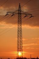 high voltage power line on the evening sky