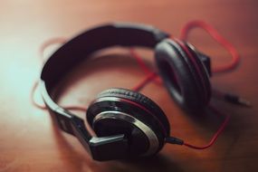 black headphones with red wire