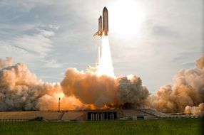 space shuttle lift off ground surface