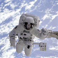 astronaut in white spacesuit in deep space