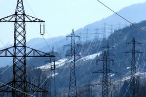 huge pylons of power lines in the mountains