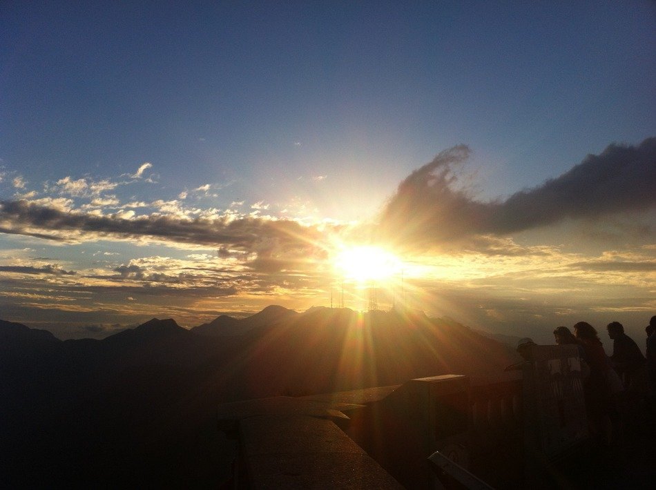 sunset over the statue of Christ the Redeemer in rio de janeiro