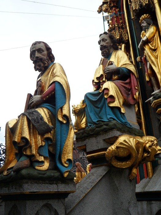 sitting men statues, detail of Schoener Brunnen, germany, nuremberg
