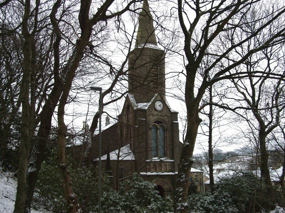 church in the middle of a snowy park