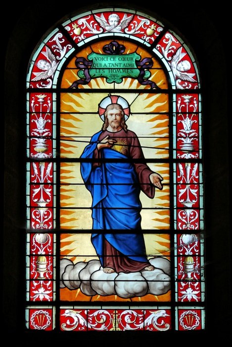 Church stained glass with a picture of a saint