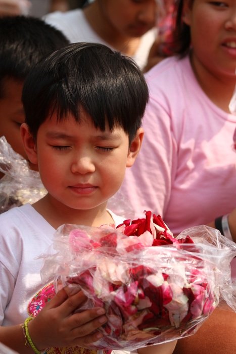 children at the ceremony with rose petals