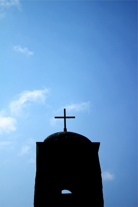 cross silhouette on the blue sky