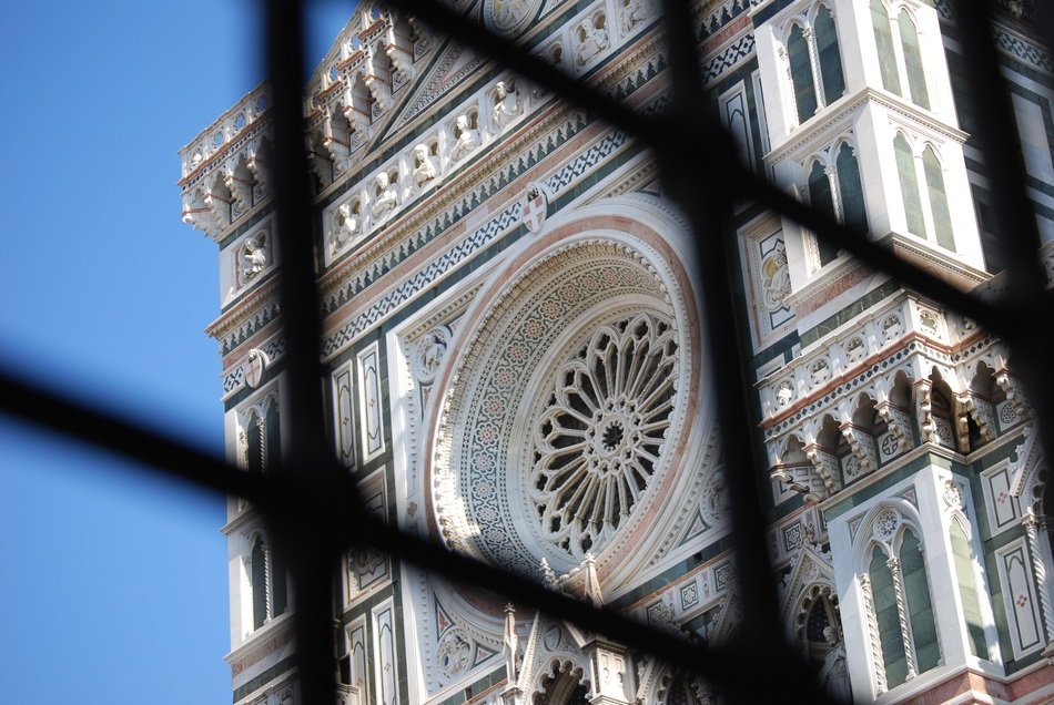 view through the bars of the cathedral in florence