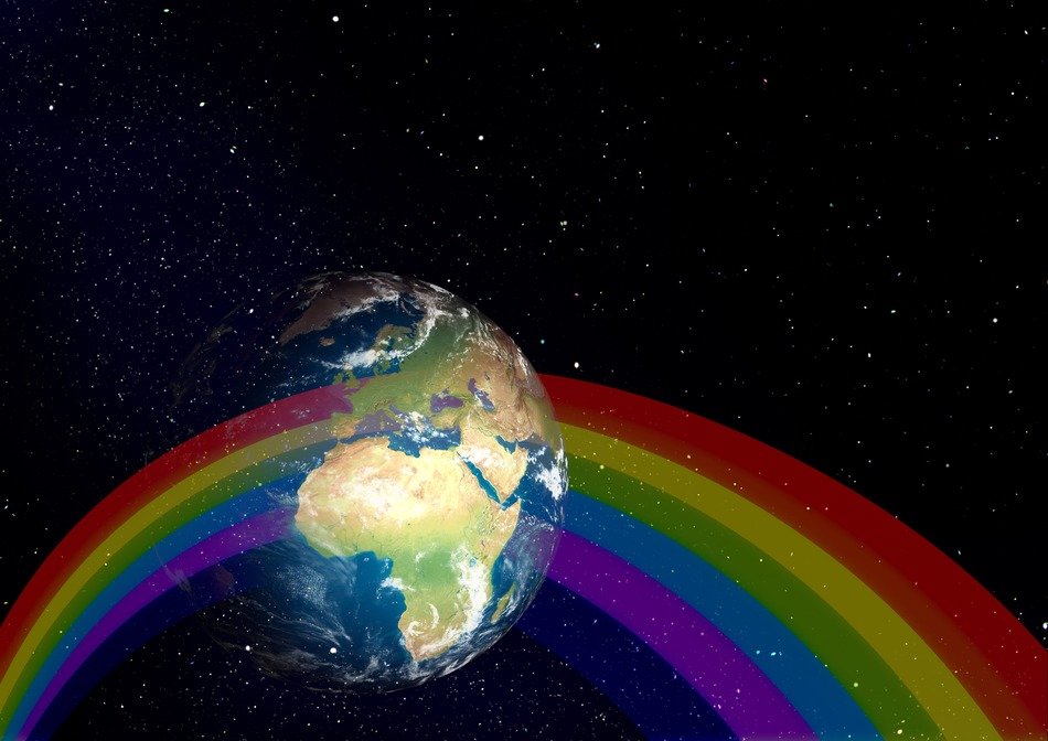 rainbow image on the background of the planet Earth