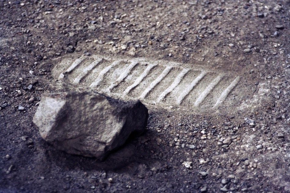 imprint of shoes on the moon