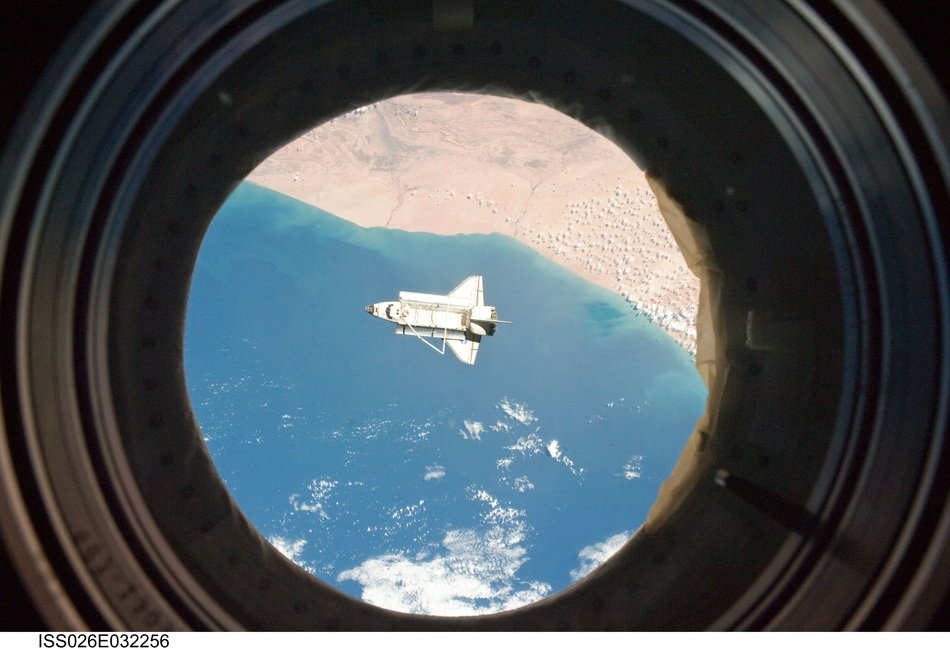 space shuttle on the clouds
