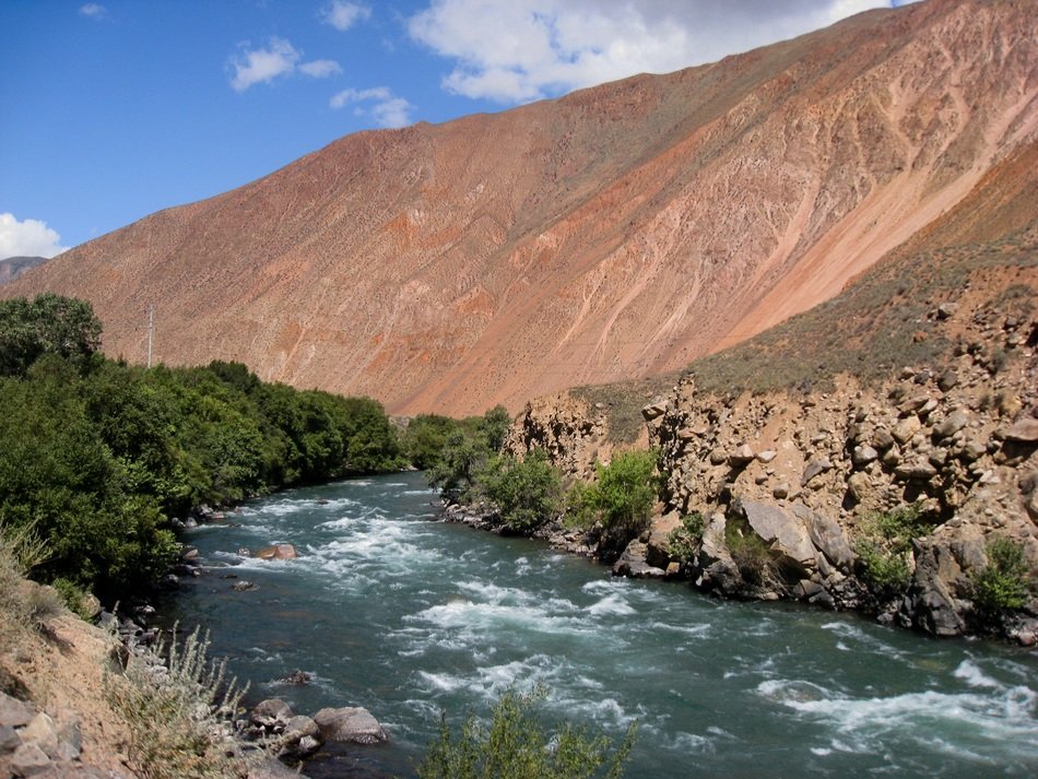 river near a hill in kyrgyzstan