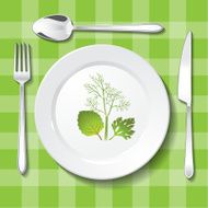 Vegetarian table appointments on green tablecloth