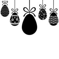 Decorative Easter eggs hanging on ribbons with bows