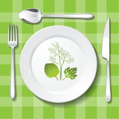 Vegetarian table appointments on green tablecloth
