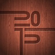 Engraved 2015 Happy New Year typographic design on wood texture
