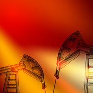 Oil derricks on sunset