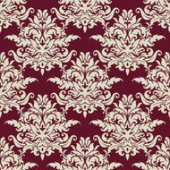Busy arabesque pattern with large floral motifs