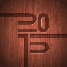 Engraved 2015 Happy New Year typographic design on wood texture