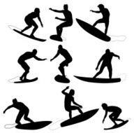 Silhouette of surfers in action