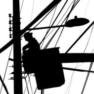 Electrician working in street lights silhouette