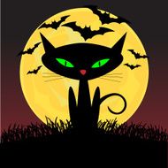 Spooky looking black cat with green eyes sitting under moonlight