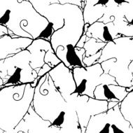 Birds on swirling branches seamless vector pattern