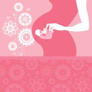 Silhouette pregnant mother with baby&#039;s bootees N2