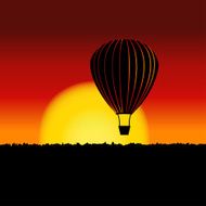 Sunset landscape with air balloon silhouette