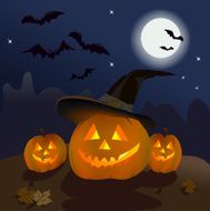 three pumpkins in the dark sky