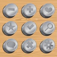 metal buttons on wooden background