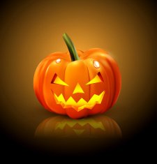 Halloween Pumpkin isolated on a dark background with reflection