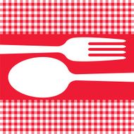 Cutlery on red tablecloth