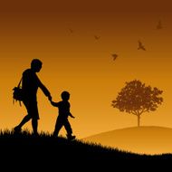 dad and son walking on grass