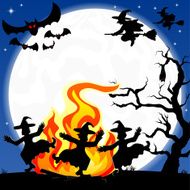 witches dancing around fire at halloween N2