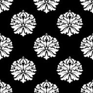 Arabesque pattern of floral motifs on black