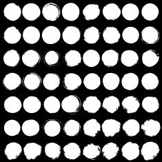 Set of Big white grunge silhouette circles on black background N2