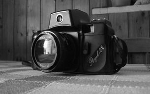 black and white photo camera on the table