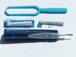 Electric toothbrush with nozzles