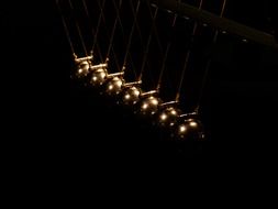 spherical ball pendulum on black background