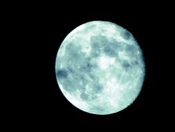 blue moon in black sky