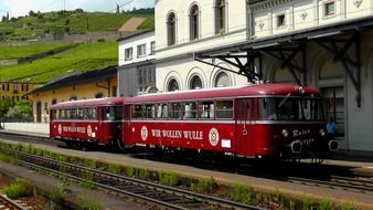 red old train on rails