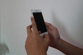 mobile phone in the hands of man