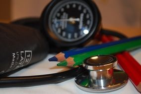 pencils lay on blood pressure measuring equipment