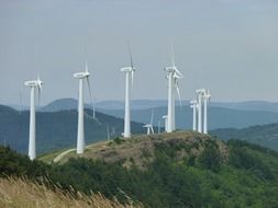 many wind turbines in the mountains