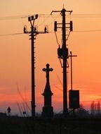 roadside cross under power lines