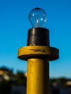 light bulb at blue sky, symbol of idea
