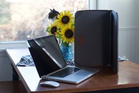 laptop with a cover on the table