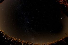 dark starry sky taken with the fisheye lens