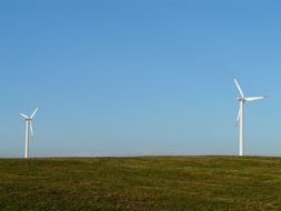 wind turbines on a green field